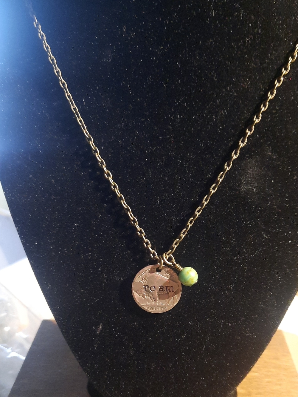 ROAM bronze-tone coin pendant necklace with green bead accent